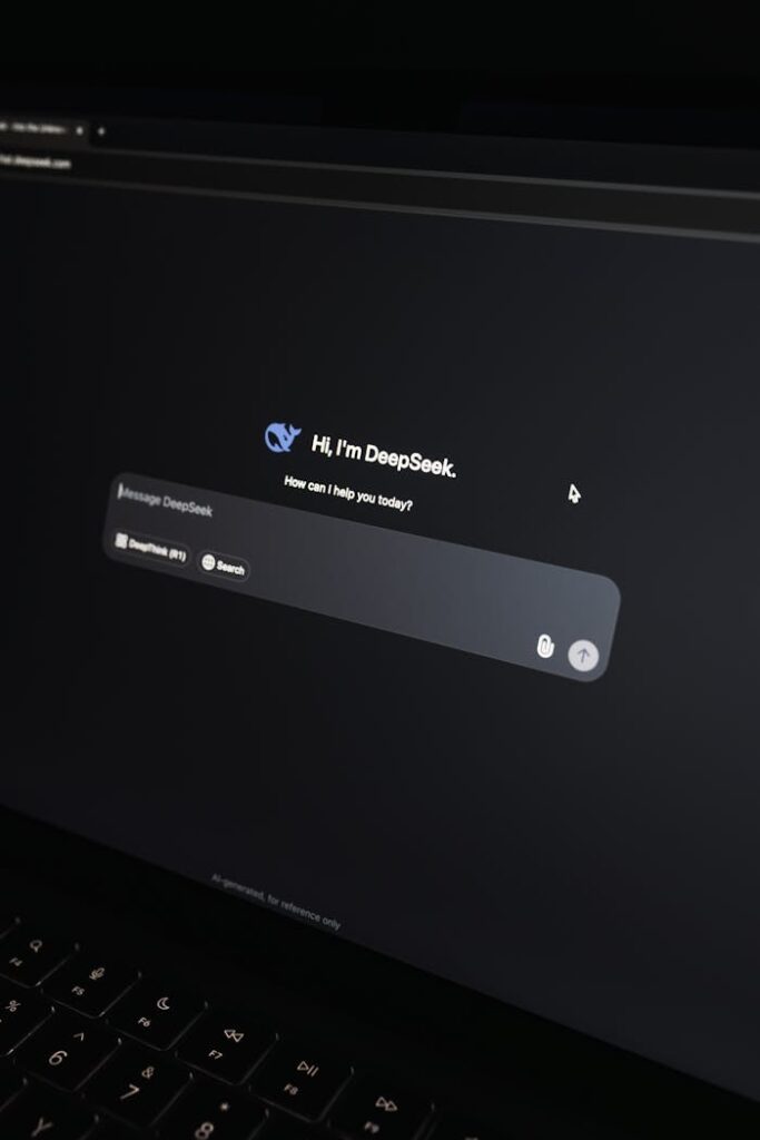 Close-up of an AI chat interface on a laptop screen in a dark setting.